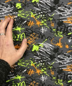 Baumwolljersey Graffiti in orange und grün auf dunkelgrau 2